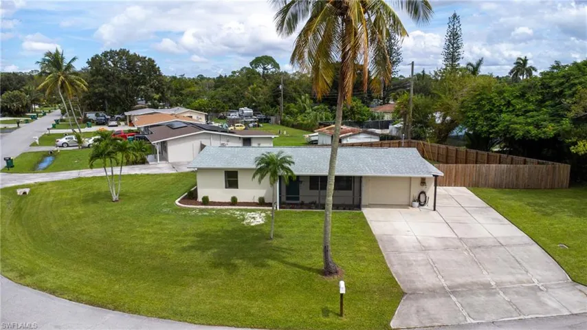Single story home with a front lawn and a garage