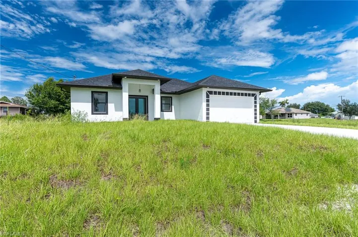 Prairie-style house with a garage