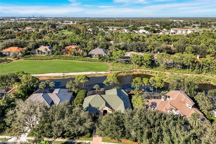 Aerial of House and Golf Course and Lake view