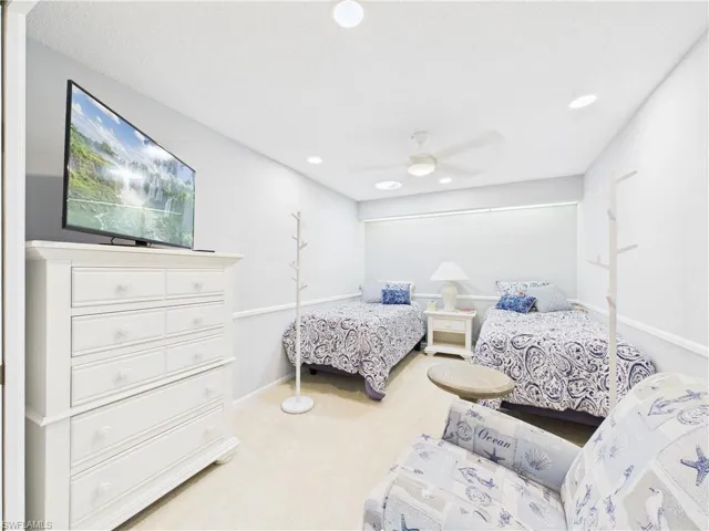 Bedroom featuring carpet and a ceiling fan