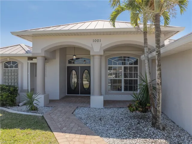 Double Door entrance and paver walkway and driveway