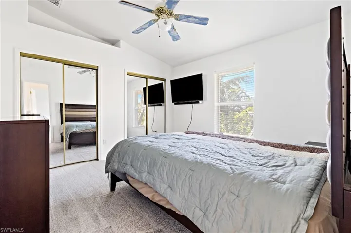 Guest Bedroom with  two closets and a ceiling fan
