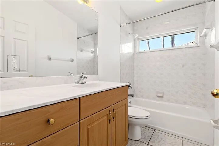Guest Bathroom with vanity, and shower / bathtub combination