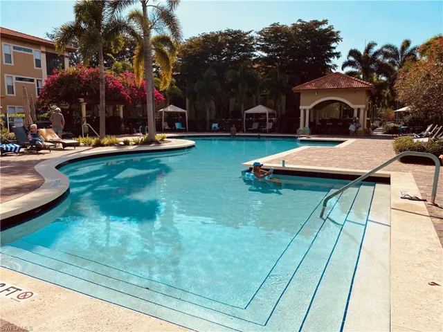 Community pool featuring a gazebo and a patio