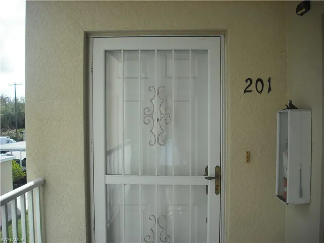 Doorway to property featuring a balcony