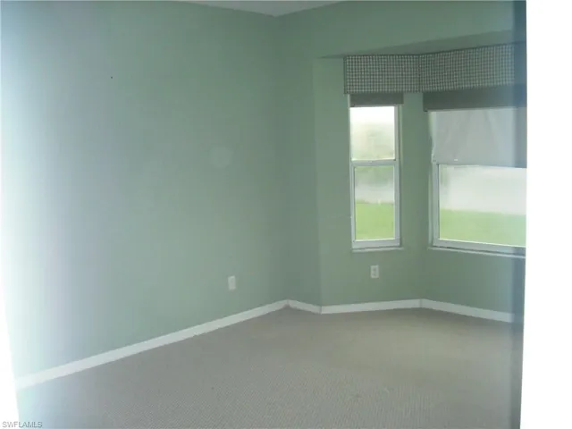 Empty room featuring carpet floors