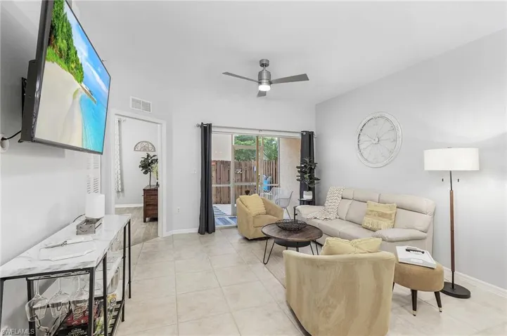 Spacious great room with sliders to patio