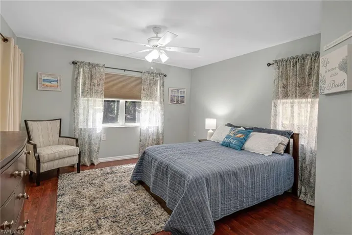 Master Bedroom featuring dark wood-type flooring and ceiling fan