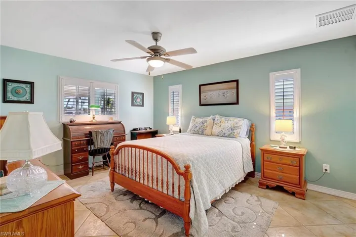 Bedroom featuring ceiling fan and light tile patterned floors