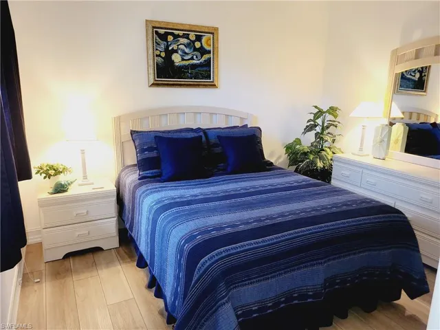 Bedroom with light hardwood / wood-style floors