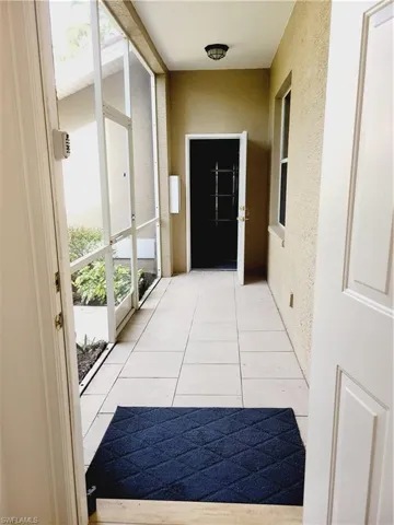 Entryway featuring light tile patterned floors