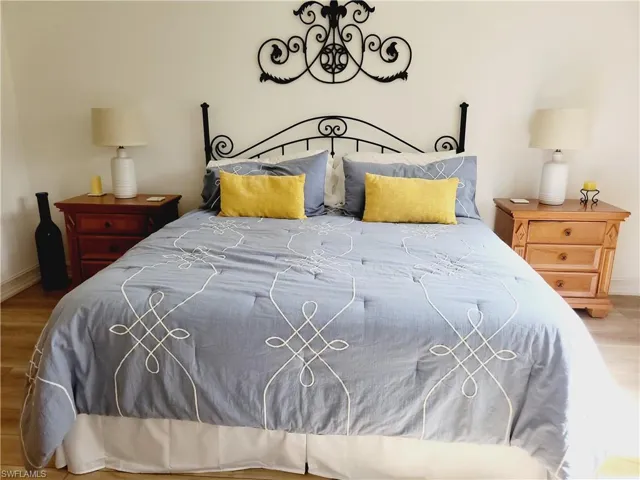 Bedroom with hardwood / wood-style floors