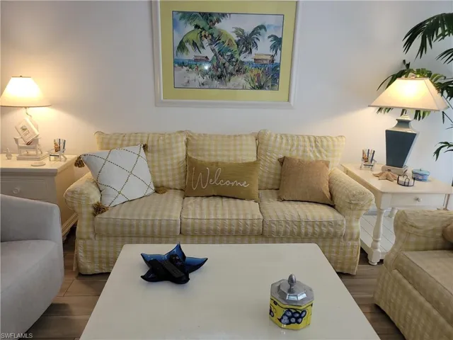 Living room with hardwood / wood-style flooring