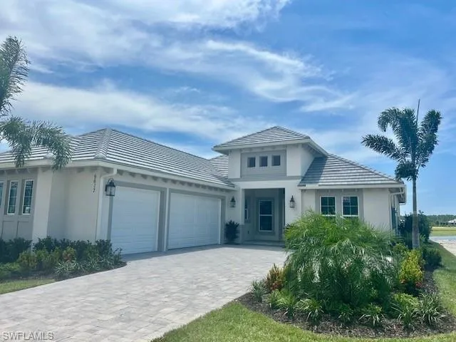 View of front facade featuring a garage