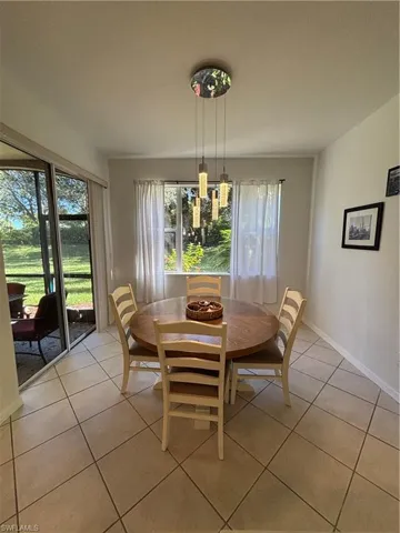 Dining room featuring light tile patterned floors