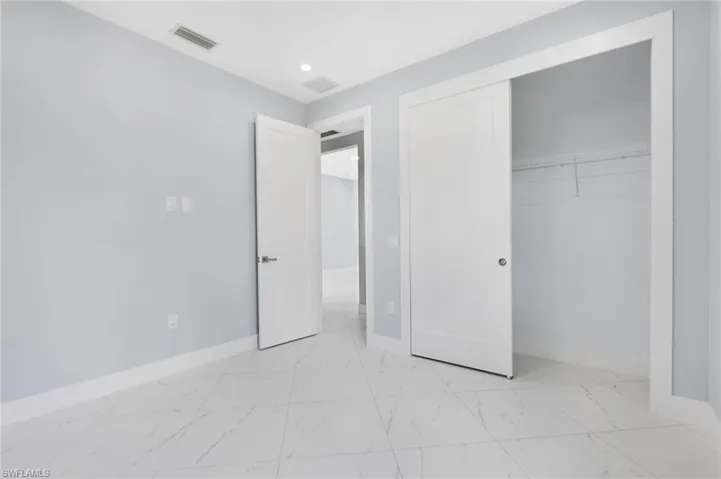 Unfurnished bedroom featuring a closet