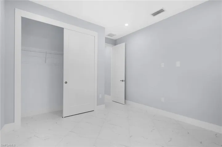 Unfurnished bedroom featuring a closet