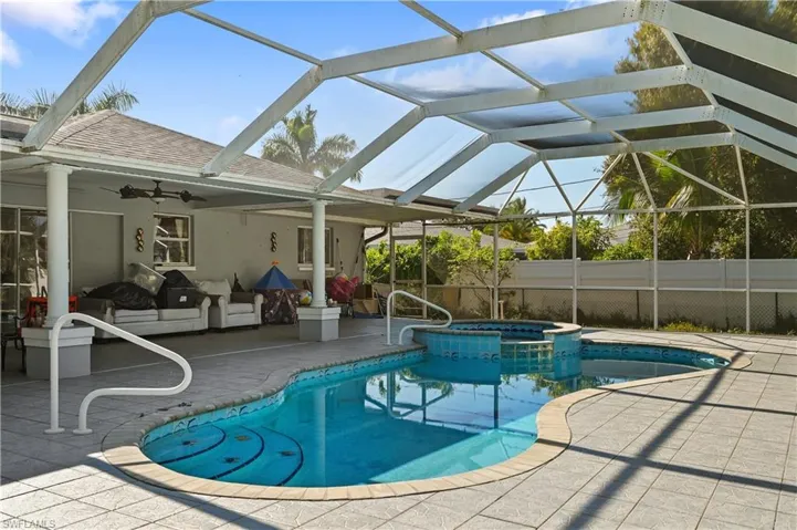 View of pool featuring a patio area and a lanai