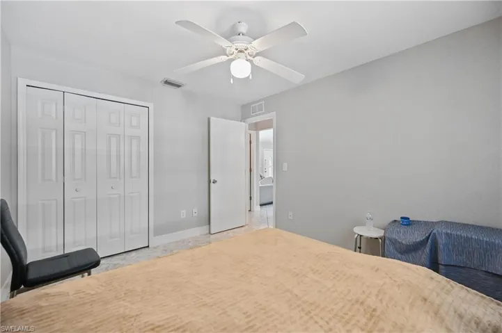 Bedroom featuring a closet and ceiling fan