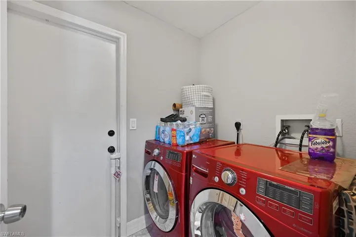 Laundry room with washing machine and dryer
