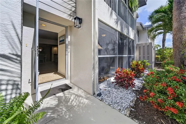 Front walkway entry. Front door has a glassed screen door allowing for plenty of natural light.