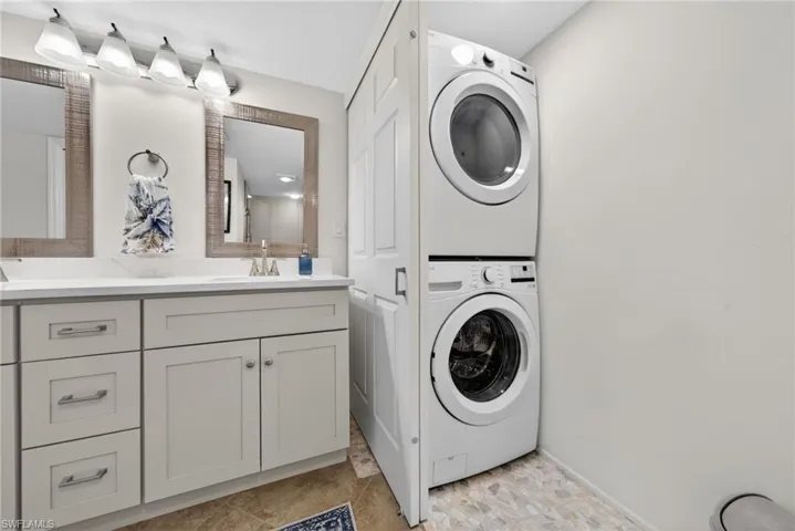Stackable washer/dryer located for ease in the Primary Bathroom