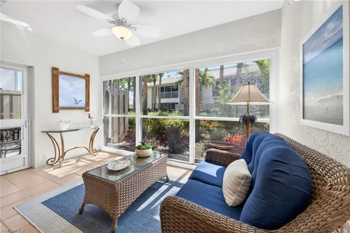 You are able to open the enclosure on the sun room to enjoy the outdoor weather!  Door leading to the open-air patio off Primary Bedroom