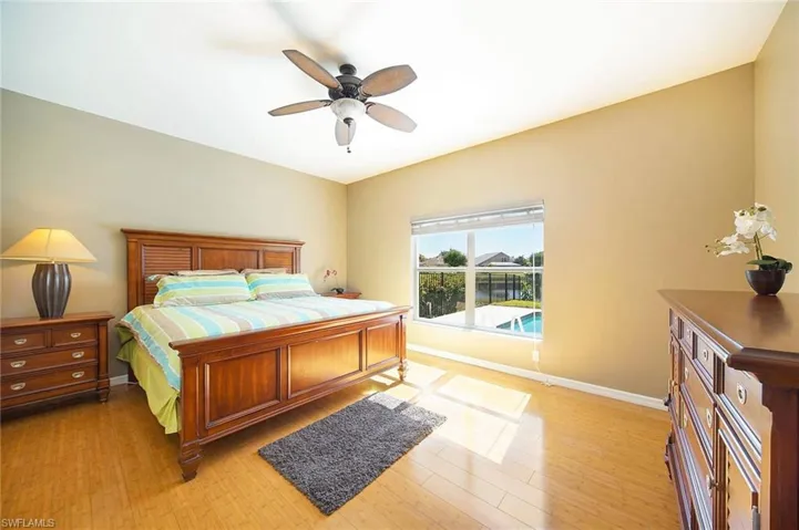 Bedroom featuring light wood finished floors and ceiling fan