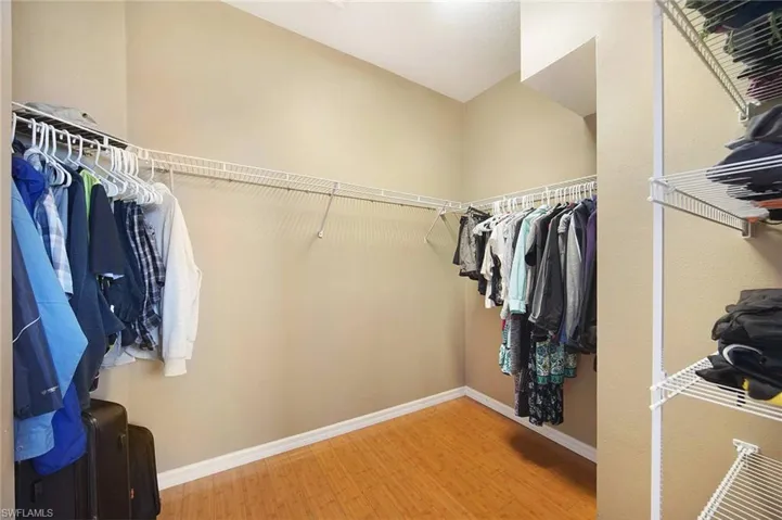 Walk in closet featuring light wood-style floors