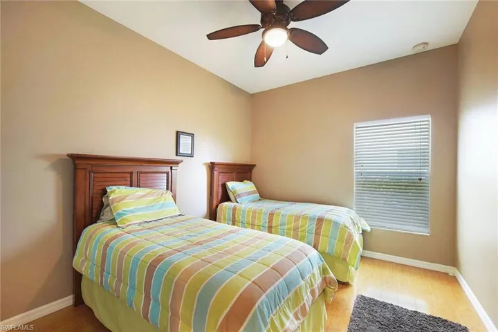 Bedroom featuring light wood-style flooring and a ceiling fan