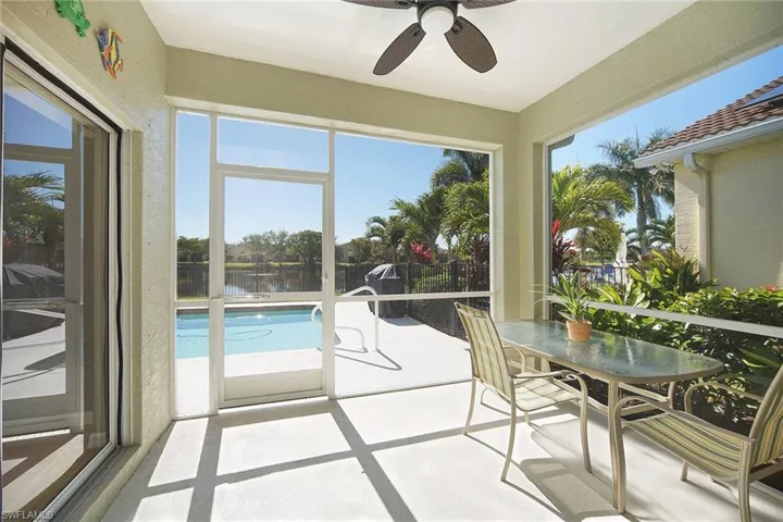 Sunroom / solarium with a water view
