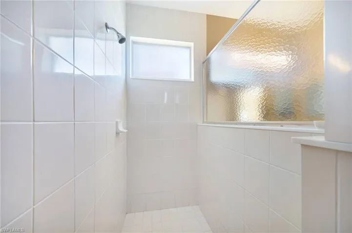 Bathroom with a tile shower