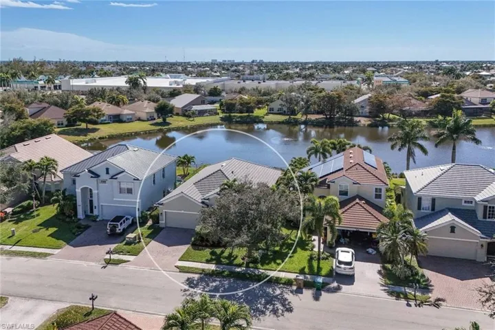 Aerial view of property featuring a nearby body of water