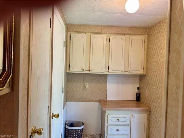 Unfurnished office with wallpapered walls