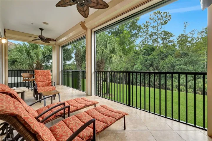 Sunroom / solarium featuring tile patterned flooring and healthy amount of natural light
