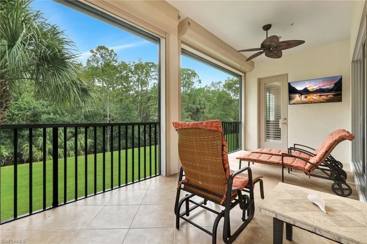 Sunroom / solarium featuring tile patterned floors