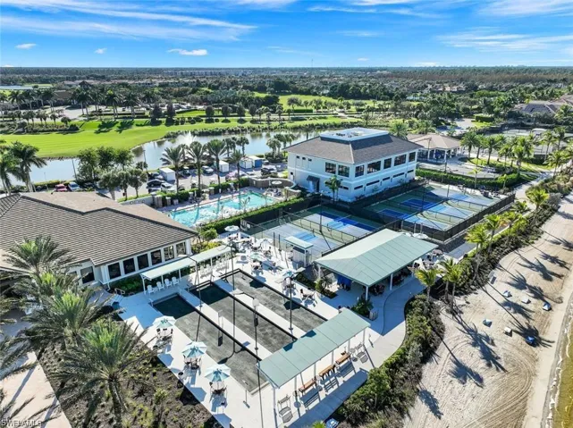 Bird's eye view of a pool area and a large body of water