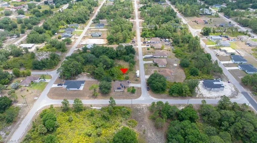 Aerial view of residential area with a tree filled landscape
