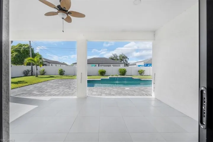 View of pool with a patio area and a fenced backyard