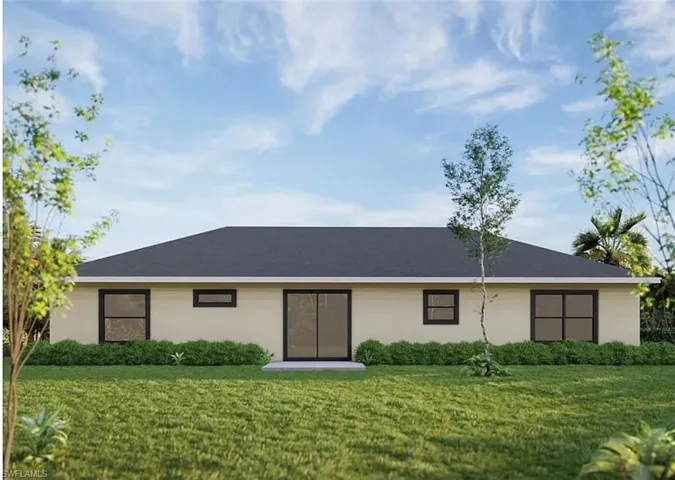 View of front facade featuring a front yard and stucco siding