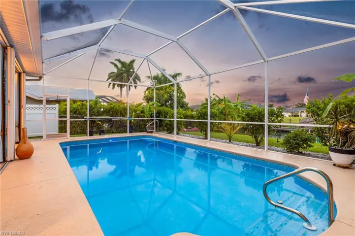 View of swimming pool with glass enclosure