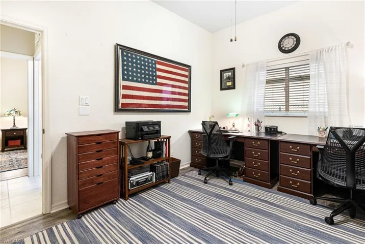 Office with light tile patterned flooring