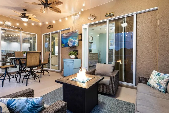 View of patio / terrace featuring a fire pit and ceiling fan