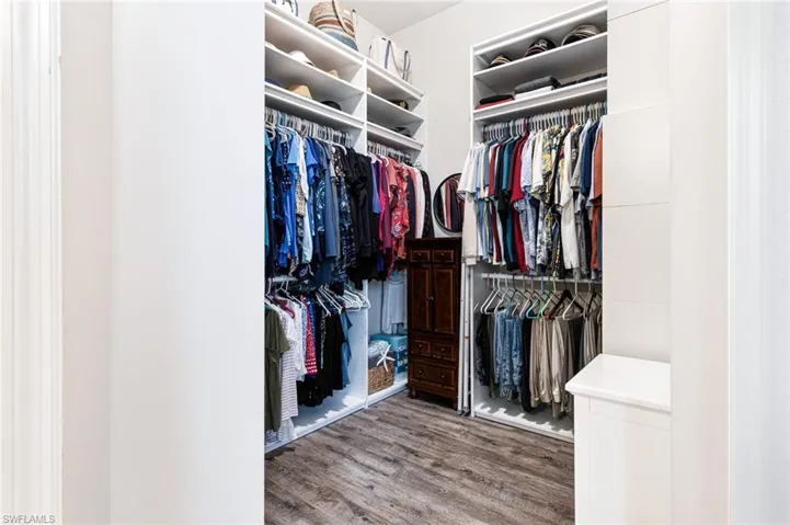 Walk in closet featuring hardwood / wood-style floors