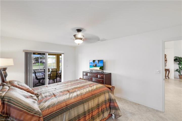 Primary Bedroom with view to pool and spa.