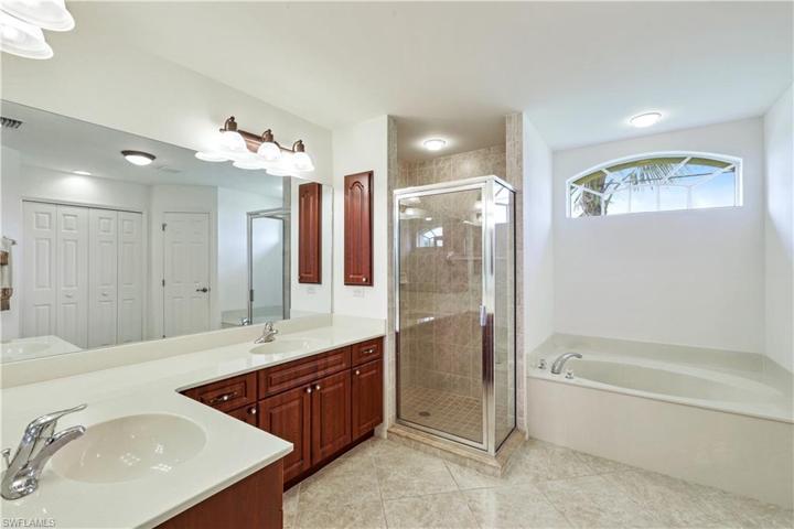 Enormous Master Bathroom has dual sinks and separate shower and tub! Lots of natural light!