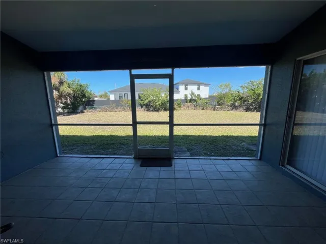 Rear covered & Screened Lanai with natural light, great from entertaining.