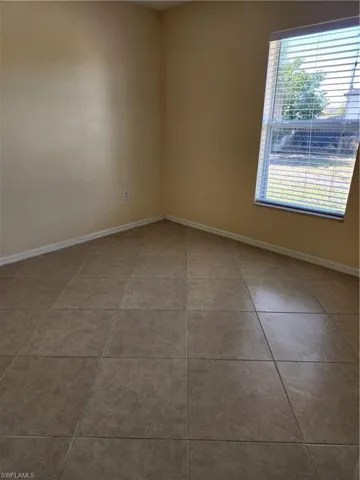Back or 3rd Bedroom and light tile floors throughout.