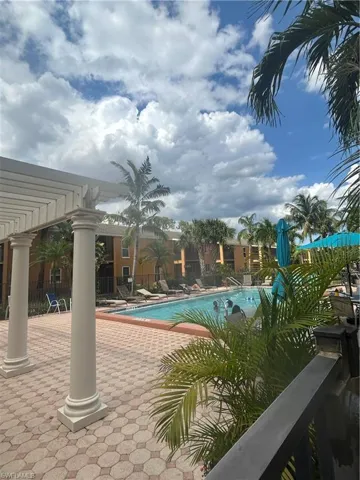 View of swimming pool with a pergola and a patio area