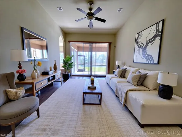 Living room with wood finished floors, ceiling fan, and recessed lighting